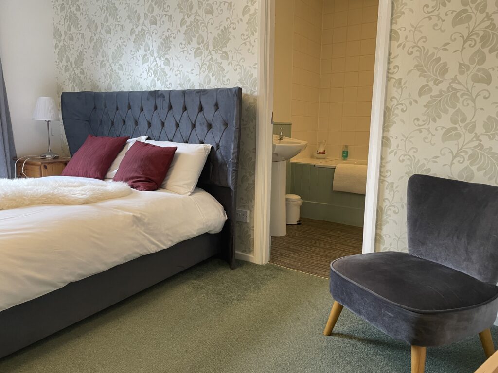 A comfortable double room with ensuite bathroom at The Sun Inn